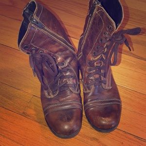 Brown laced up combat boots